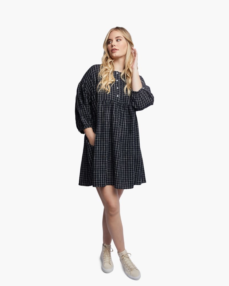 Front of a model wearing a size XXL Nico Swing Dress in Black Grid by ABLE. | dia_product_style_image_id:271524